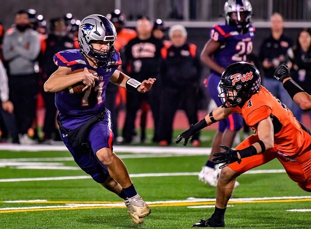 Liberty quarterback Cole O'Brien runs from the Pittsburg defense in the Patriots blowout win over the Pirates on Saturday in the CIF Division 1-A finals at Saddleback College. (Photo: Louis Lopez)