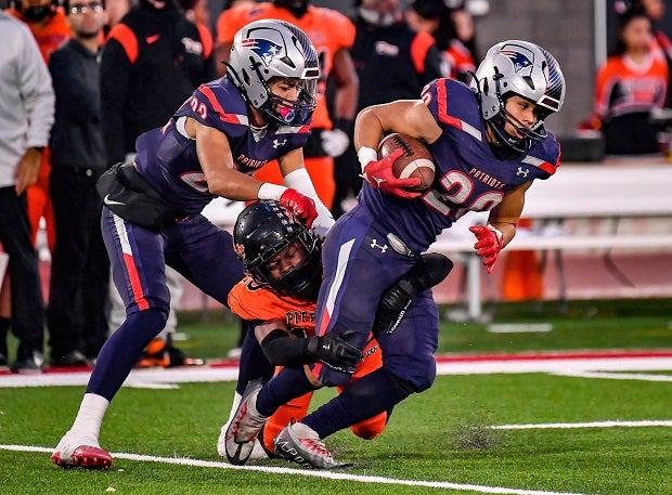 Mehki Delouth plow forward for some tough yards in Liberty's 48-20 win over Pittsburg on Saturday in the CIF Division 1-A finals at Saddleback College. (Photo: Louis Lopez)