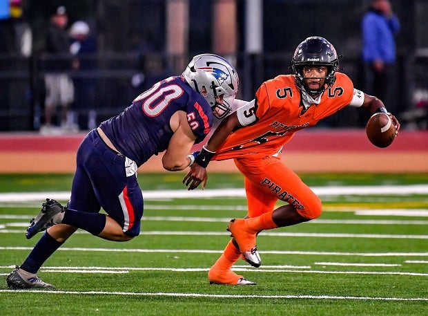 Liberty defensive lineman Dylan Delgado chases down Pittsburg quarterback Jaden Rashada in the first half of the Patriots' win over Rashada's Pirates on Saturday in the CIF Division 1-A finals at Saddleback College. (Photo: Louis Lopez)