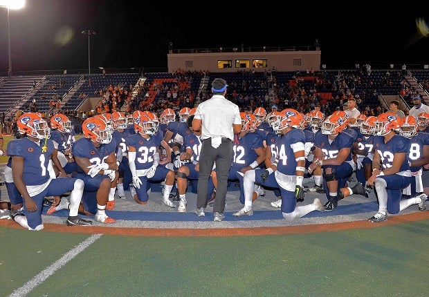 Bishop Gorman coach Brent Browner talks to his squad after a 42-7 opening-night win over Utah's Corner Canyon. Gaels quarterback Micah Alejado threw three TDs in the win.
