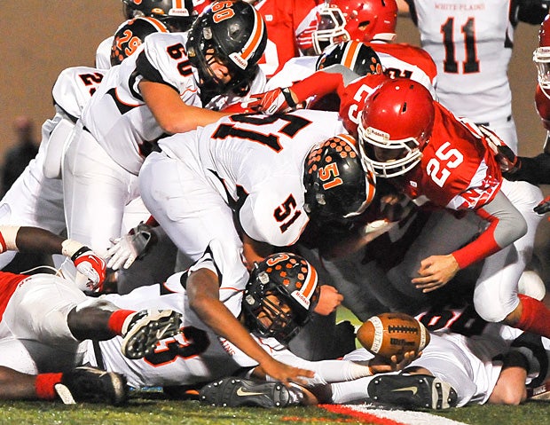 White Plains (N.Y.) quarterback Cameron Crabbe tries to sneak in for the touchdown under the North Rockland (Thiells, N.Y.) defense.