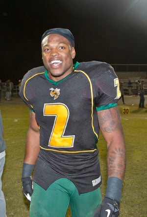 Derrick Henry flashes a smile after breaking the
59-year-old national rushing record.