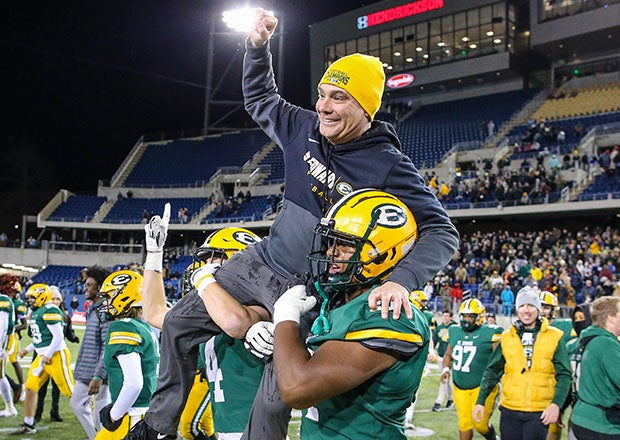 St. Edward head coach Tom Lombardo is carried off the field after leading his team to a 28-14 win over Springfield in the Division I state championship game last December. (Photo: Scott Reed)