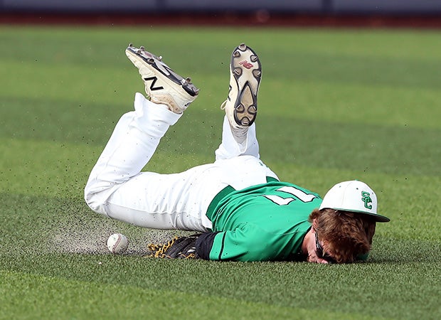 Southlake Carroll (Southlake, Texas) outfielder Ryan Ryskoski attempts to make a diving catch during a quarterfinal game in the UIL 6A Regional playoffs.