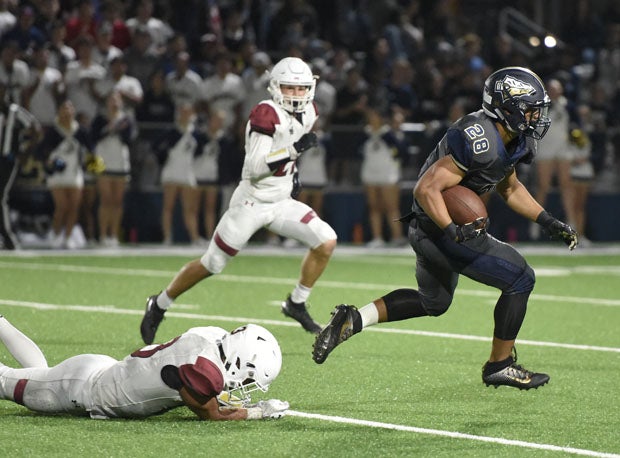George Holani is off to the races on his 43-yard touchdown run that gave Bosco a 35-21 lead midway through the fourth quarter.