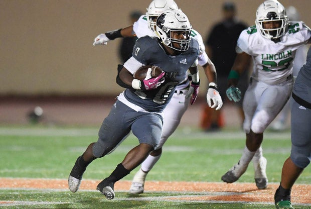 Helix running back Christian Washington (20). 