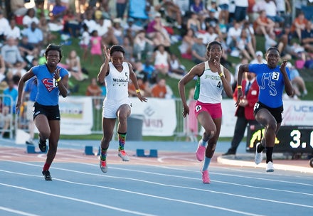 Ariana Washington (middle in pink) is the first Long Beach Poly girl to win either the 100 or 200 and she did both in the same meet.