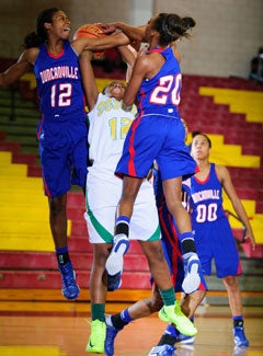 Defense here from Ariel Atkins (12) and
Tasia Foman (20) is what helped 
Duncanville give up just 32 points per
game.