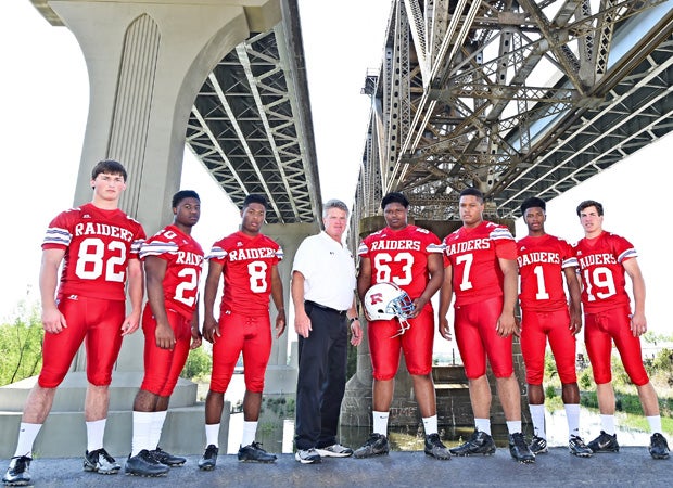 Arcbishop Rummel head coach Jay Roth (center) poses during a photo shoot with seven of his top players under the Huey P. Long Bridge. From left to right are players: Todd Weller, Israel Tucker, David Hensley, Joe Oliver, Briston Guidry, Kristian Fulton and Chase Fourcade.  