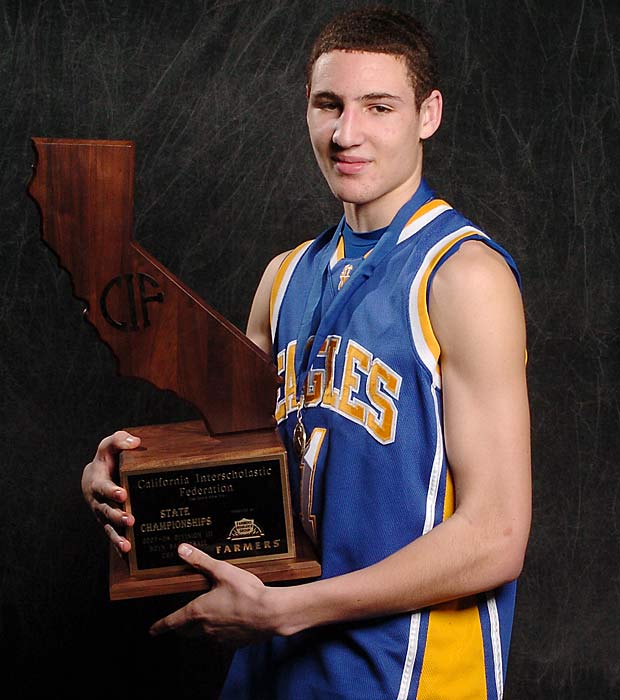Thompson holding up Santa Margarita's 2008 state championship trophy.