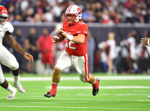 Katy quarterback Bronson McClelland breaks into the open.