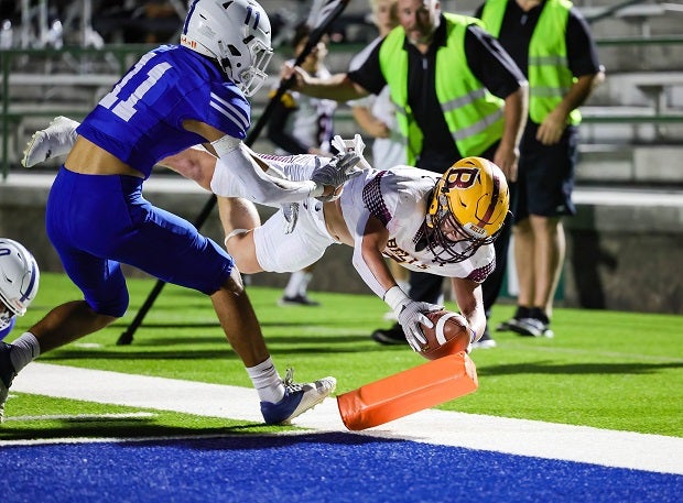 Bells running back Brock Baker dives for a touchdown during the Bells playoff game against vs Blooming Grove. (Photo: Robbie Rakestraw)