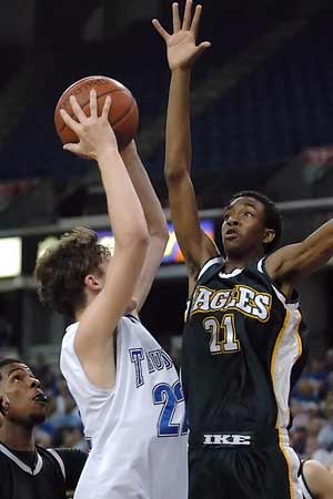 Rocklin's Cody Kale (22) tangles with Bernard Ireland (21).