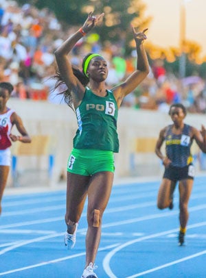 Washington holds up her hands to signal theJackrabbits sign. 