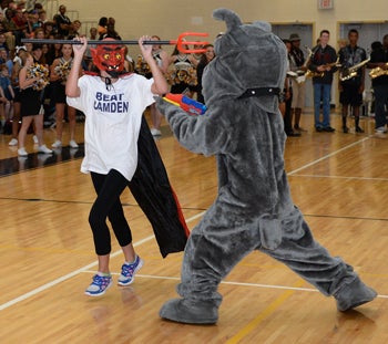 The Camden Bulldog cools off a mock Lugoff-Elgin mascotduring Camden's pep rally held on Friday afternoon beforethe big rivalry game on Friday night.