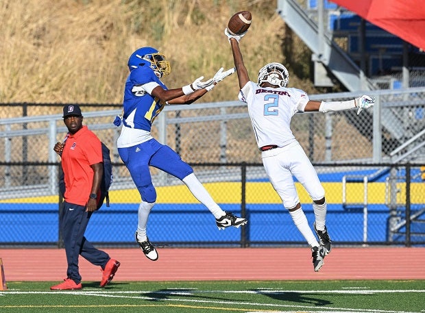 A Destiny Christian Academy junior varsity defensive back makes a spectacular play against a Benicia wide receiver in a 21-16 win. (Photo: Jason Weed)