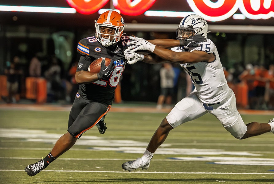 Bishop Gorman running back Trey Washington looks to break a tackle in first-half action of his team's 38-28 win Friday over No. 1 St. John Bosco in the MaxPreps Game of the Week.(PHOTO: Jenni Webber)
