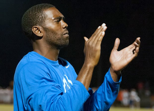 Former NFL great Randy Moss is coaching football at Victory Christian Center, where his son Thad plays. Moss is shown along the sideline during Thursday's win over Marvin Ridge.  