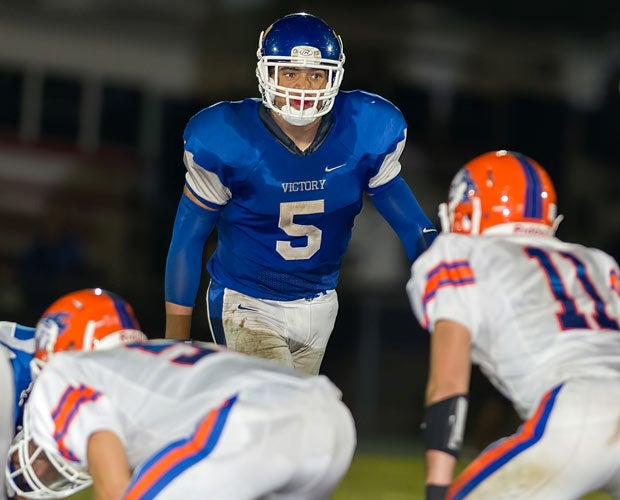 Victory Christian Center defensive lineman Thad Moss waits for the snap during Thursday's game.
