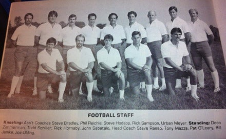 The coaching staff of the 1985 St. Xavier Bombers wore tight shorts, long white tube socks and featured Urban Meyer (bottom right).