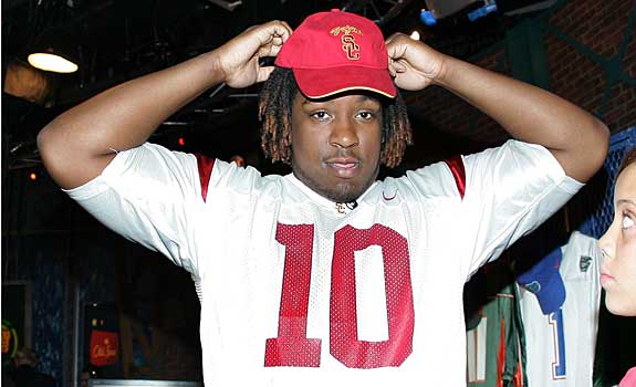 Seantrel Henderson selected a USC jersey on National Signing Day, ending months of speculation, at least temporarily.