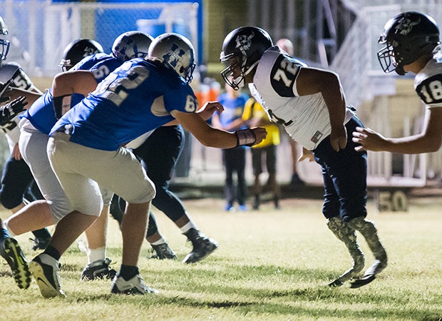 Martel faces off against a Haskell offensive lineman during the second half, which was played despite a lack of full power for the stadium lights. 