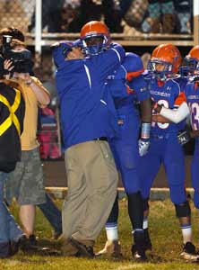 Green-Beckham gets congratulatedon the sideline.