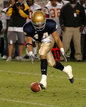 Giancarlo Stanton picks up a loose ball as
a junior on the Notre Dame football team.