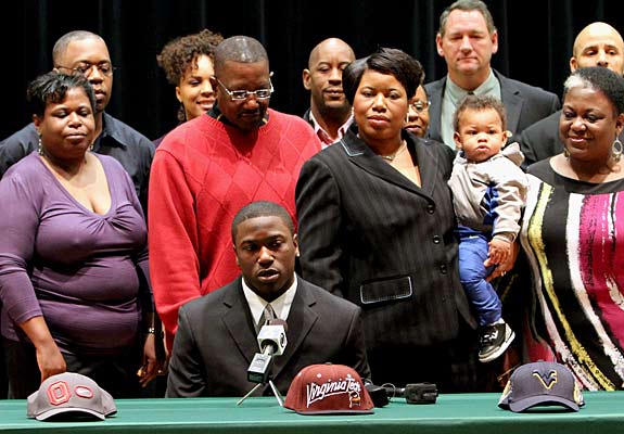 This was a tense moment before Joel Caleb picked up the Virginia Tech hat and eventually signed with the Hokies over Ohio State and West Virginia.