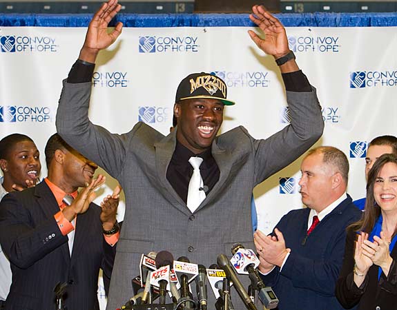 The nation's No. 1 recruit celebrates his decision to attend Missouri, bringing to a close a long, well-documented recruitment. Dorial Green-Beckham throws up his hands and smiles big as father John Beckham and the rest of Green-Beckham's family celebrates.