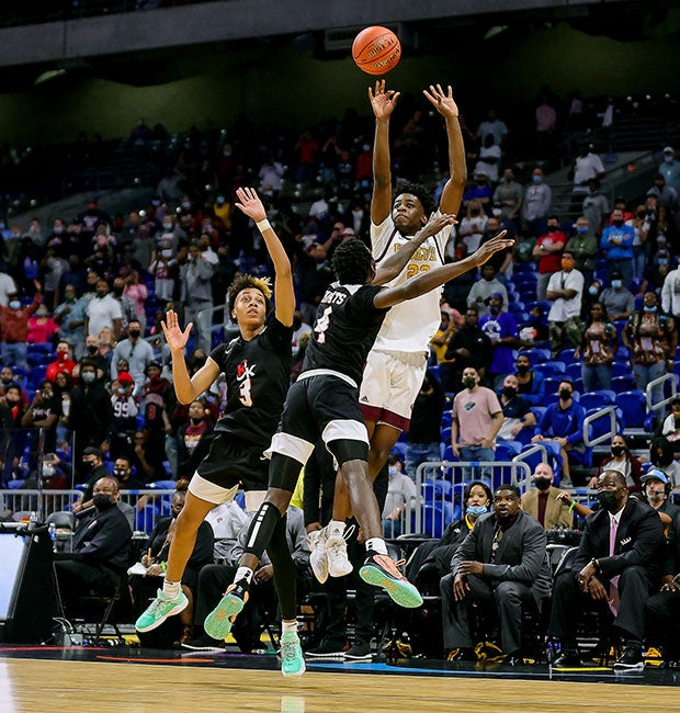 Terrance Arceneaux connects on a three-pointer over two Kimball defenders at the end of regulation to send the game into overtime.