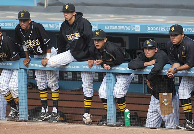 San Fernando players in the Dodger Stadium dugout during the 2011 CIF Los Angeles City Section Division I title game.