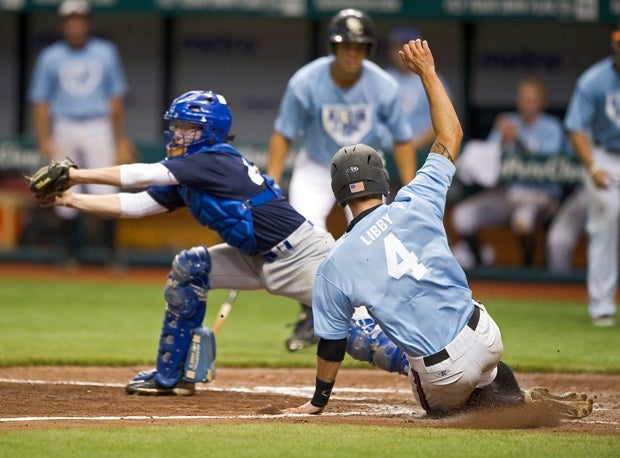 A player slides into home plate at the 2011 Tampa Bay All-Star Classic, played at Tropicana Field.