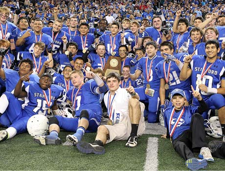 Stamford players celebrate after winning the Texas Class 1A Division I state championship.