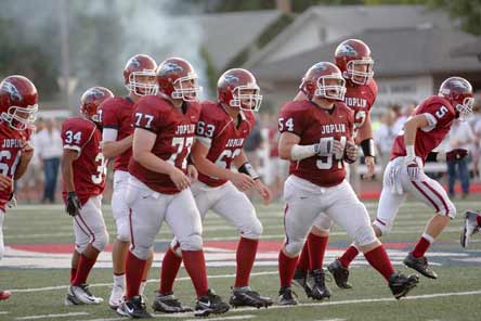 The Joplin High football team got back to normalcy on Sept. 10, playing its first home football game since an F-5 tornado destroyed a large swath of the Missouri city.