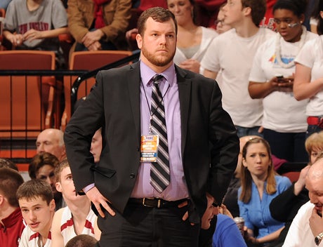 When coach Kevin Woods looks onto the court, he sees a team "really invested in the program and committed to their families and their schoolwork. They're one of the most polite group of young men I've ever come across."