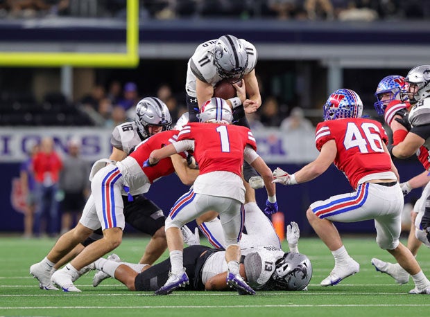 Guyer quarterback Jackson Arnold (11) goes up high.
