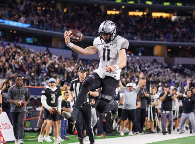 Guyer quarterback Jackson Arnold leaps into the end zone for a 15-yard first-quarter touchdown.
