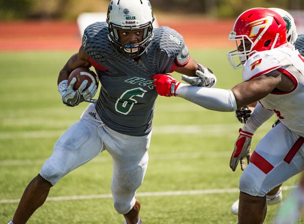 Helix senior Isaac Taylor-Stuart (left) contributed on both sides of the ball in high school.