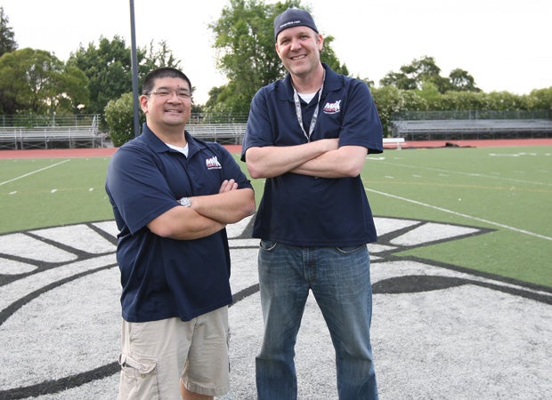 MaxPreps freelance photographer Dennis Lee (left) and Director of Photography Todd Shurtleff pose after finishing up the photo shoot.