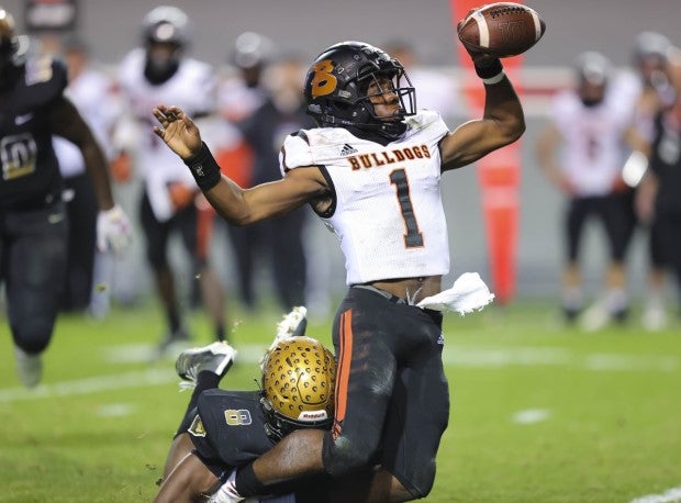 Malaki Hamrick tackles the quarterback in the Lions state championship game victory.