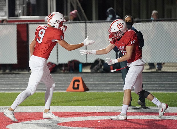 Receiver Trenton Veith (right) celebrates his game-winning touchdown for Center Grove.