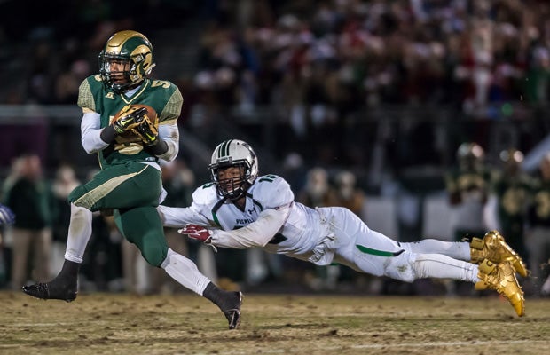 Roswell's Xavier McKinney makes a diving tackle of Grayson's Ernest Tiller during the second quarter of Friday's 6A semifinal playoff game.