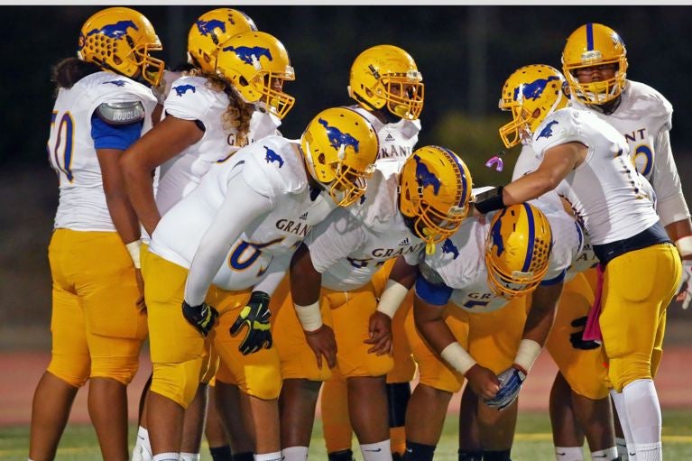 Two California high school football players shot before game, one killed
