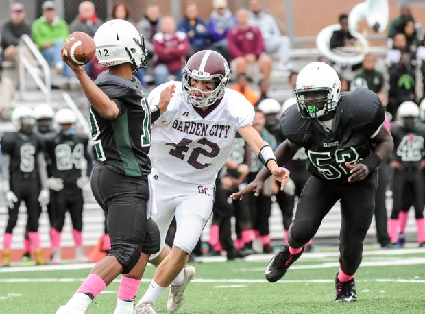 Garden City defensive end Andrew DeSantis (42) led the Trojans to back-to-back state titles.