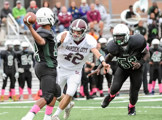 Garden City defensive end Andrew DeSantis (42) led the Trojans to back-to-back state titles. 