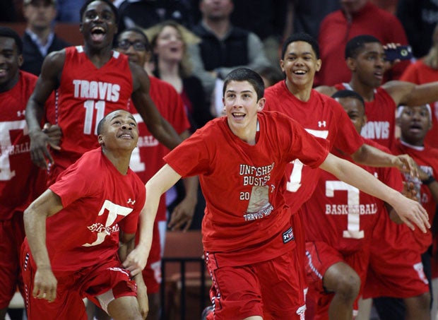Fort Bend Travis players begin to celebrate as the final seconds tick away in the Texas Class 5A state title game against South Grand Prairie.