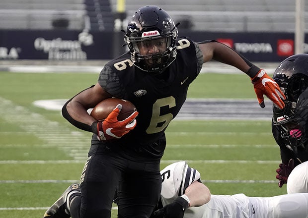 Freedom sophomore Jeff Overton fights to reach the end zone in Virginia's Class 6 state championship game, resulting in one of this 39 touchdowns on the season. (Photo: Danny La)
