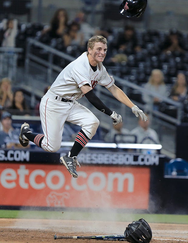 La Jolla (Calif.) shortstop Ben Wintringer celebrates after scoring the game-winning run against Point Loma at Petco Park in San Diego.