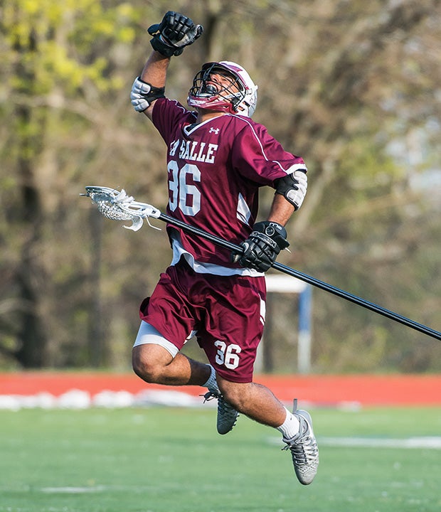 A La Salle Academy player (R.I.) player reacts to a goal scored by his team during a game against Moses Brown.